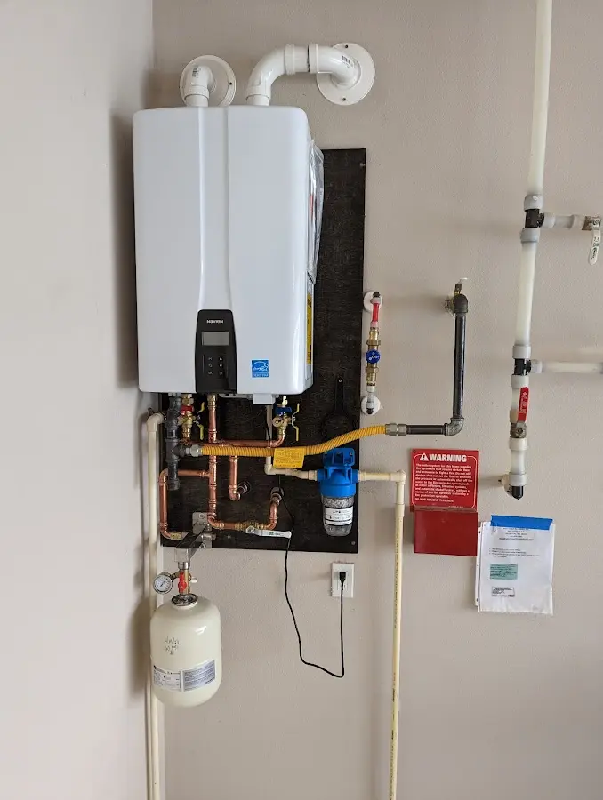 Professional plumber installing copper piping in a Hernando home